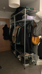 Open Wardrobe with clothes rail.