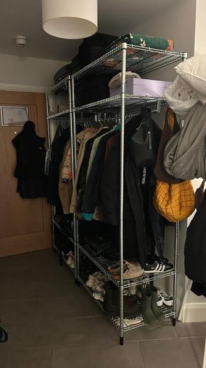 Open Wardrobe with clothes rail.