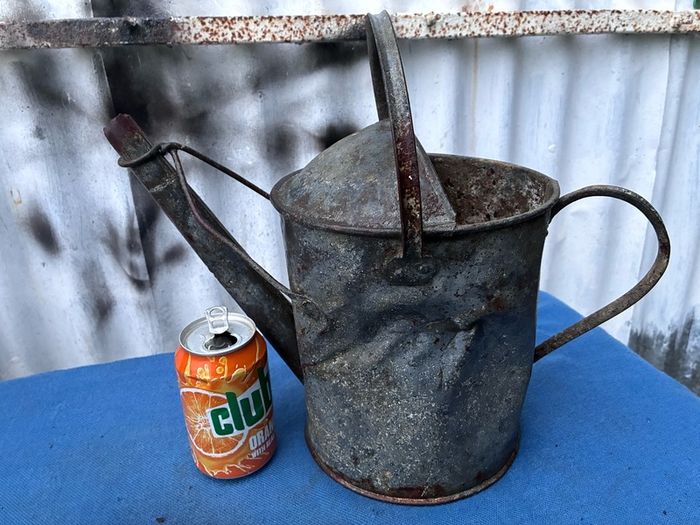 Vintage galvanised watering can