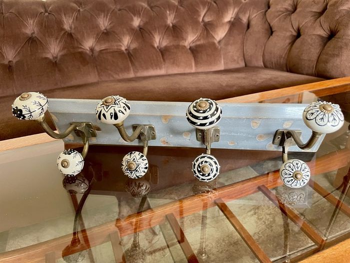 New Unused Stylish Entryway Mounted Ceramic and Brass Coat Hanger