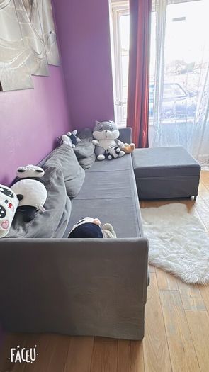 Grey fabric sofa with matching footstool