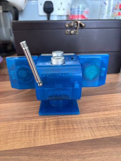 Portable FM-AM radio with blue transparent casing