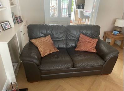 2 dark leather sofas