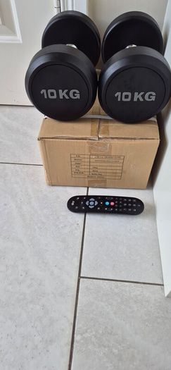 two brand new sets of rubber coated dumbbells 2x12.5kg  2x10kg