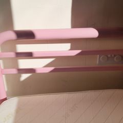 Pink metal frame toddler bed