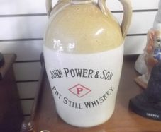 a antique john powers and son pot still whiskey stone jar