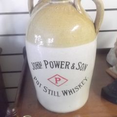 a antique john powers and son pot still whiskey stone jar