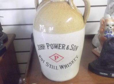 a antique john powers and son pot still whiskey stone jar