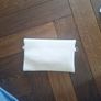 Beige clutch with gold accents Image 2