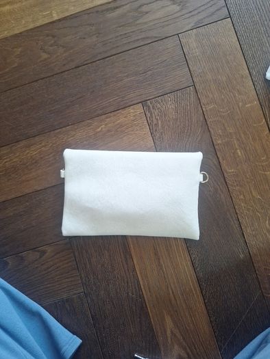 Beige clutch with gold accents