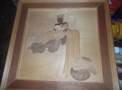 a carved wood picture