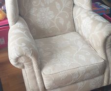 Large high-backed winged arm chair