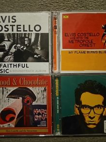 Elvis Costello CDs Collection: Unfaithful Music & Soundtrack Album. 2 CD / My Flame Burns Blue. 2 CD / Blood & Chocolate / The Very Best Of. 2 CD