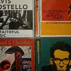 Elvis Costello CDs Collection: Unfaithful Music & Soundtrack Album. 2 CD / My Flame Burns Blue. 2 CD / Blood & Chocolate / The Very Best Of. 2 CD