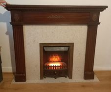 Electric fireplace and surrounds