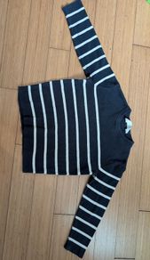 Black and white striped jumper.