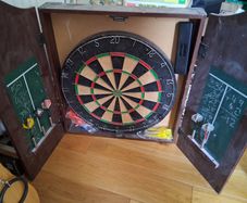 Dart Board In Cabinet