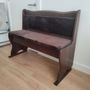 Dark wood pub bench with storage
