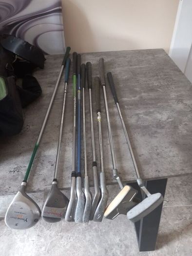 A selection of junior golf clubs and bag.