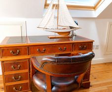 Mahogany Leather Top Partners Desk and Brown Chesterfield Captain's Chair
