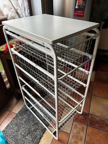 IKEA JONAXEL white storage unit with wire baskets