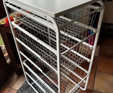 IKEA JONAXEL white storage unit with wire baskets