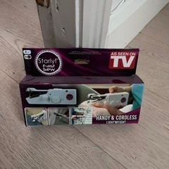 Hand-held sewing machine