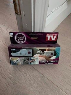Hand-held sewing machine