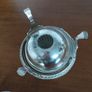A vintage silver-plated butter dish or caviar bowl with a three-legged lid. Image 7