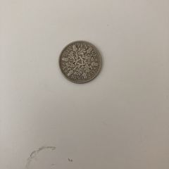 English six pence 1930