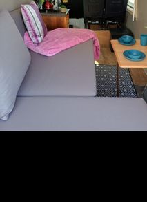 couch, bed, storage, campervan