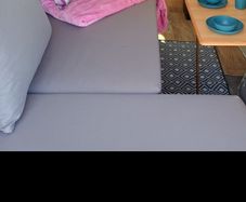 couch, bed, storage, campervan
