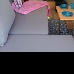 couch, bed, storage, campervan