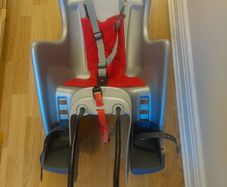 Bycycle child seat carrier