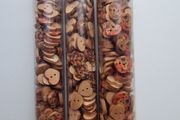Tubes of wooden buttons