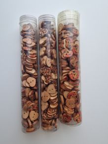 Tubes of wooden buttons