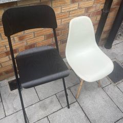 Two white chairs and one bar stool