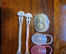 Soothers, clips and storage cases