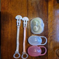 Soothers, clips and storage cases