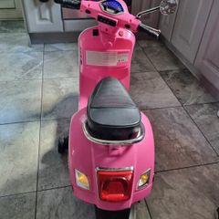 Pink girl's motorbike