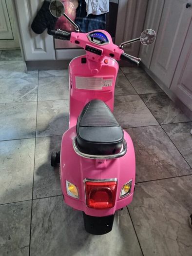 Pink girl's motorbike