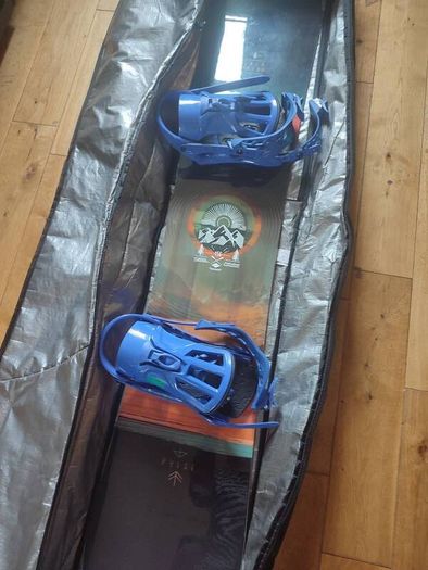 Salomon snowboard with Rossignol bindings in travel case