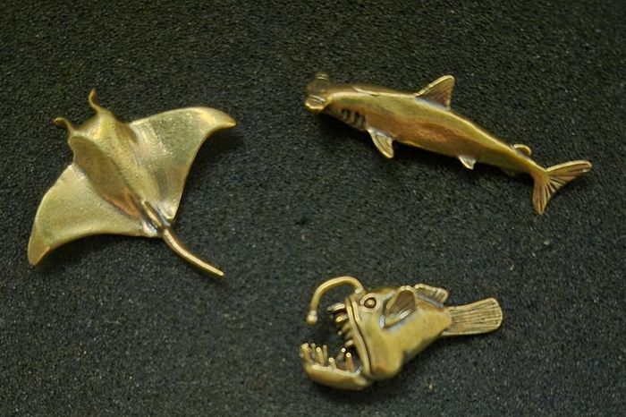 3 brass fish.