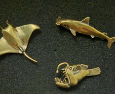 3 brass fish.
