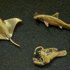 3 brass fish.
