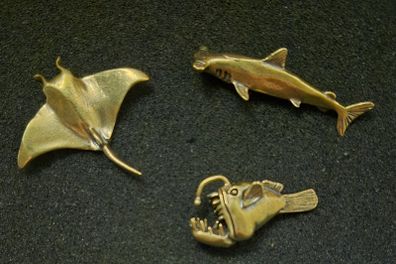 3 brass fish.