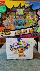 Pokemon Prismatic Evolutions Etb and Ascended Heros pin collection