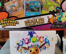 Pokemon Prismatic Evolutions Etb and Ascended Heros pin collection
