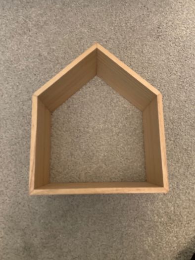 Wooden decoration in the shape of a house