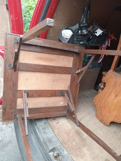 two oak chairs and an old  card table